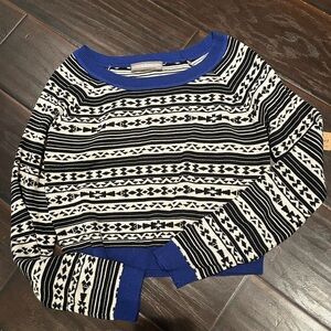 Cropped black and white patterned sweater with blue detailing